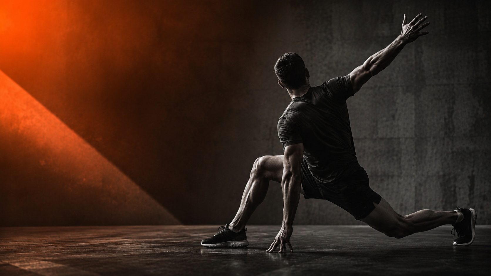Athlete moving in a dramatic ember-lit studio